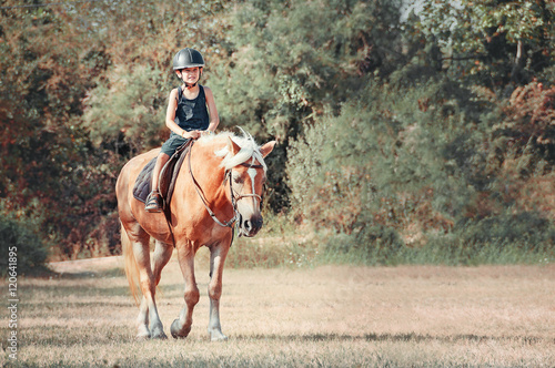 Little boy on the horse.