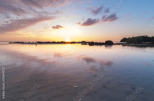 Beautiful sunset seascape color with reflection. image contain soft focus and blur due to long expose.