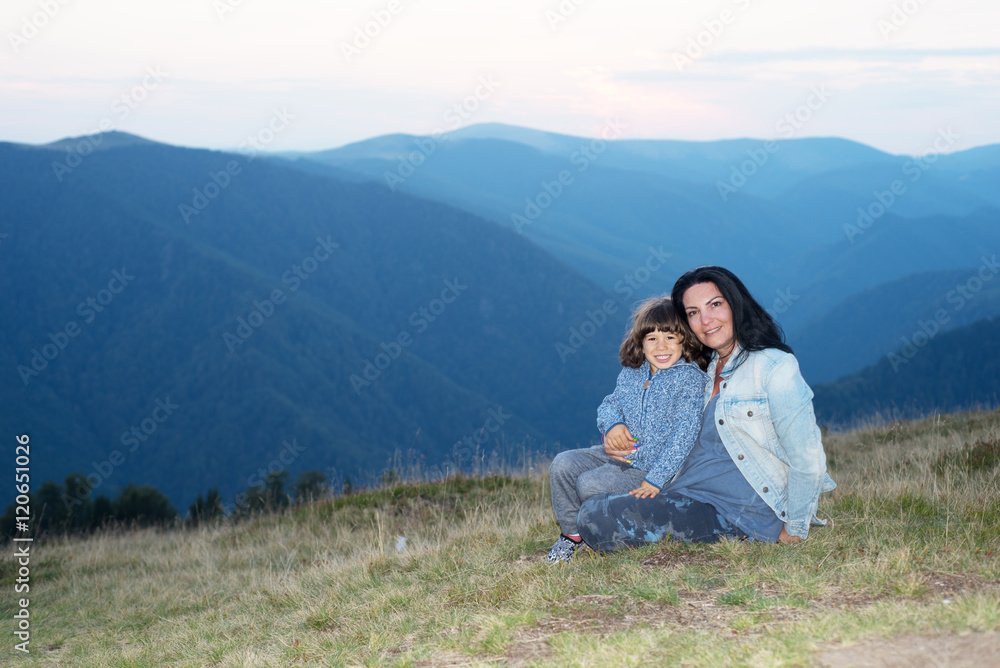 Naklejka premium Mother and son in the mountains