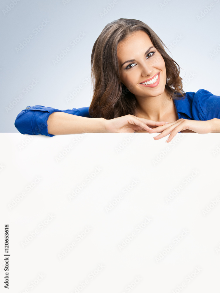 Beautiful young woman showing blank signboard Beautiful young woman showing blank signboard