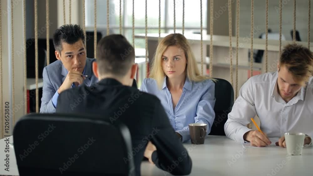 Man is having work interview sitting in office. Man is having work interview sitting in office.