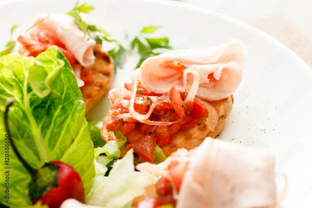 Bruschetta with tomato and ham Bruschetta with tomato and ham