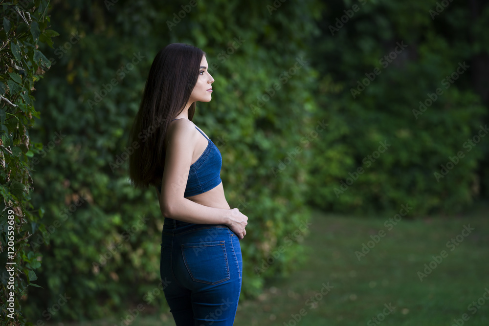Portrait of a beautiful young caucasian woman in blue jeans and denim top, clean skin, long hair and casual makeup, Portrait of a beautiful young caucasian woman in blue jeans and denim top, clean skin, long hair and casual makeup,