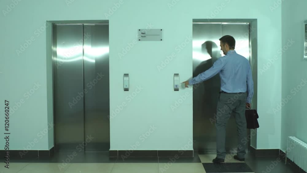young businessman waiting for Elevator young businessman waiting for Elevator