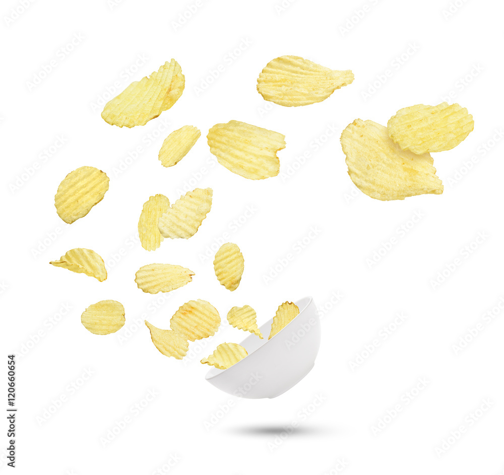 potato chips in the air fall in a bowl isolated on white backgro potato chips in the air fall in a bowl isolated on white backgro