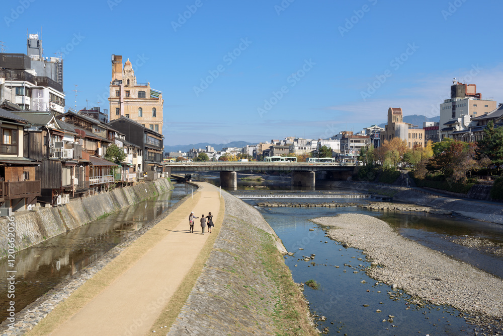  View of Kamo River at the center of Kyoto on a sunny autumn day.