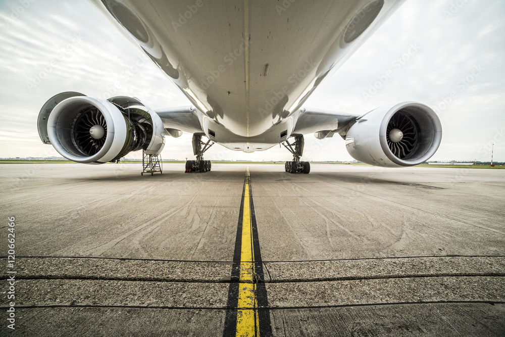 Fototapeta premium Maintenance of an airplane at the airport