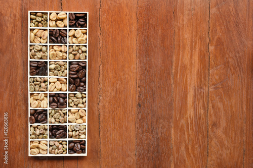different coffee forms in wooden box on wooden background