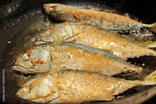 Hot cooking,Deep fried streamed mackerels "Bplaa Thuu Nung Tod". Selective focus.