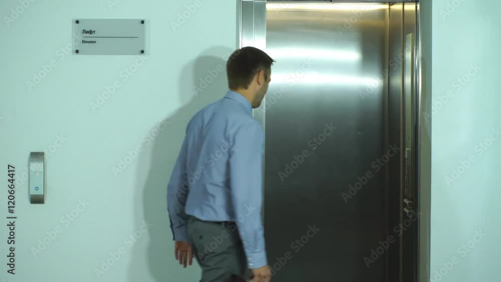 two successful businessmen meet in the Elevator two successful businessmen meet in the Elevator
