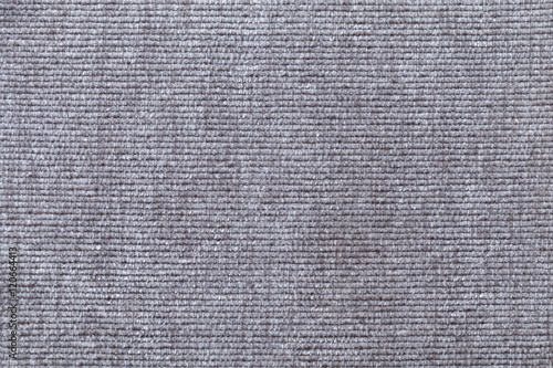 Light gray background from soft textile material. Fabric with natural texture. photo