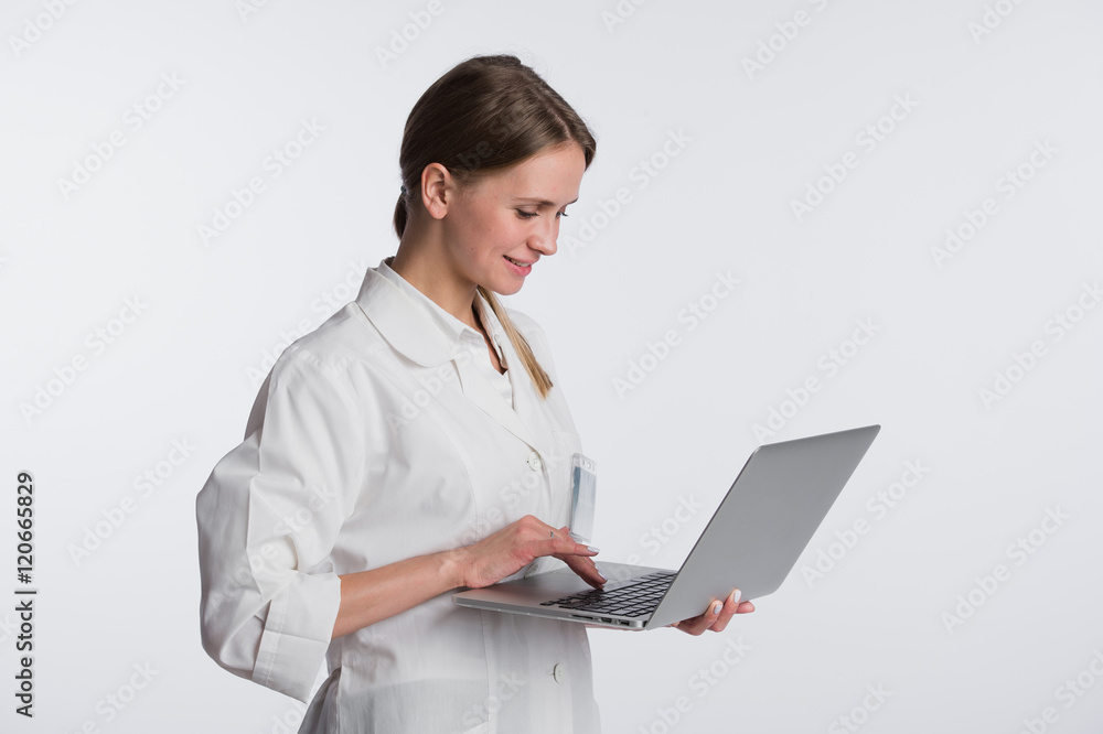 medical doctor woman smile hold tablet pc, using computer. nurse with stethoscope Isolated over white background medical doctor woman smile hold tablet pc, using computer. nurse with stethoscope Isolated over white background