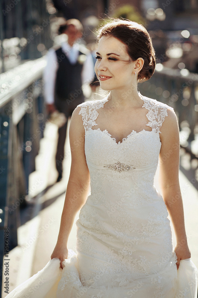 Fototapeta premium Happy newlyweds on the street