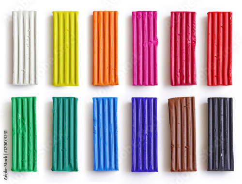 Set of colorful plasticine sticks isolated on white background. Rainbow modeling clay piece for children play and creativity.