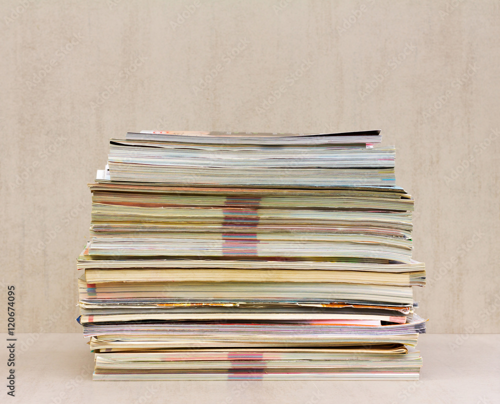 a large stack of magazines close-up, front view a large stack of magazines close-up, front view