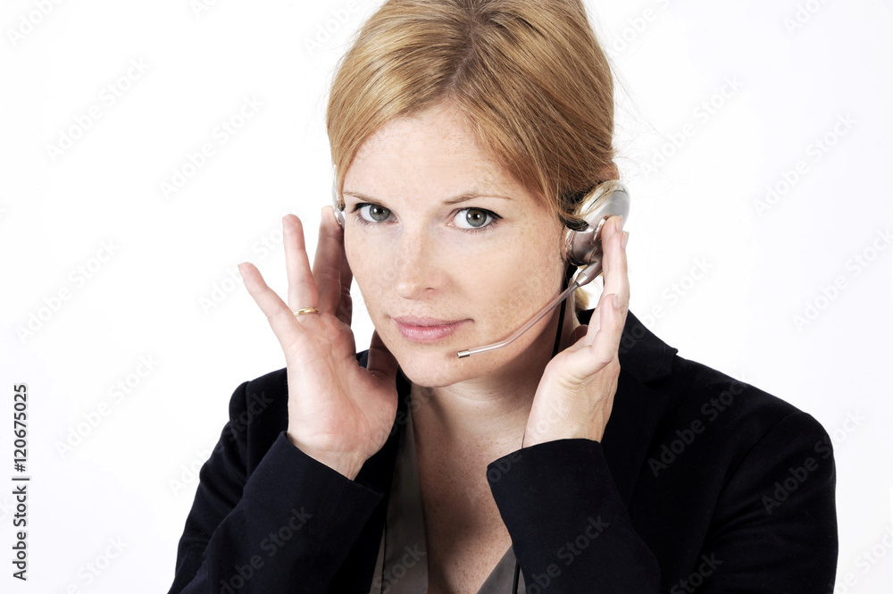 Portrait of a nice freckled face woman in a call center with phone headset. Studio shot isolated on light background Portrait of a nice freckled face woman in a call center with phone headset. Studio shot isolated on light background