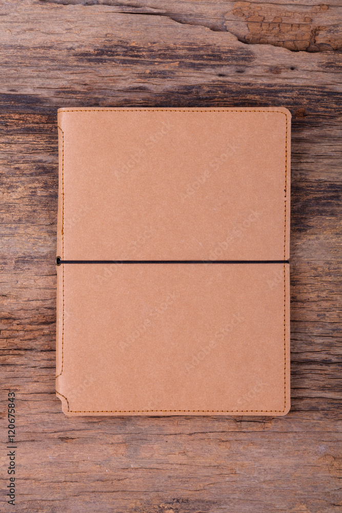 Blank empty notepad on wood background Blank empty notepad on wood background