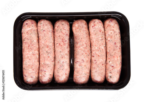 Package of raw beef sausages on white background