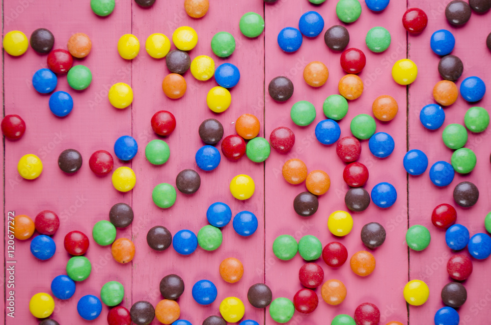 candies on a wooden pink table