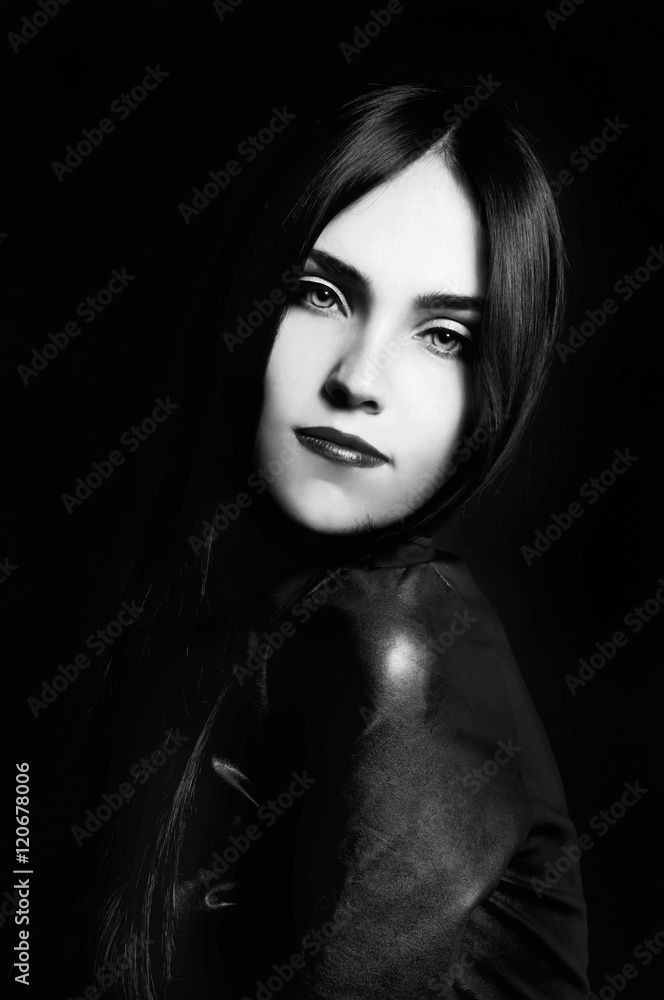 Gorgeous brunette with white skin, red lips on black backdrop Gorgeous brunette with white skin, red lips on black backdrop
