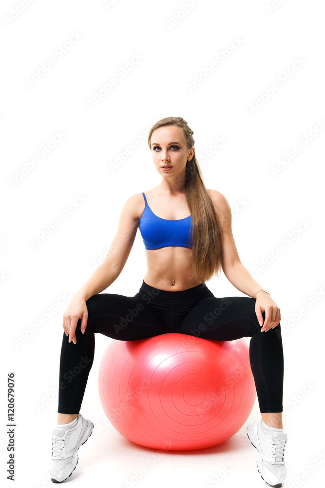 Concepts: healthy lifestyle, sport. Happy beautiful woman fitness trainer working out with fit ball isolated on white background Concepts: healthy lifestyle, sport. Happy beautiful woman fitness trainer working out with fit ball isolated on white background