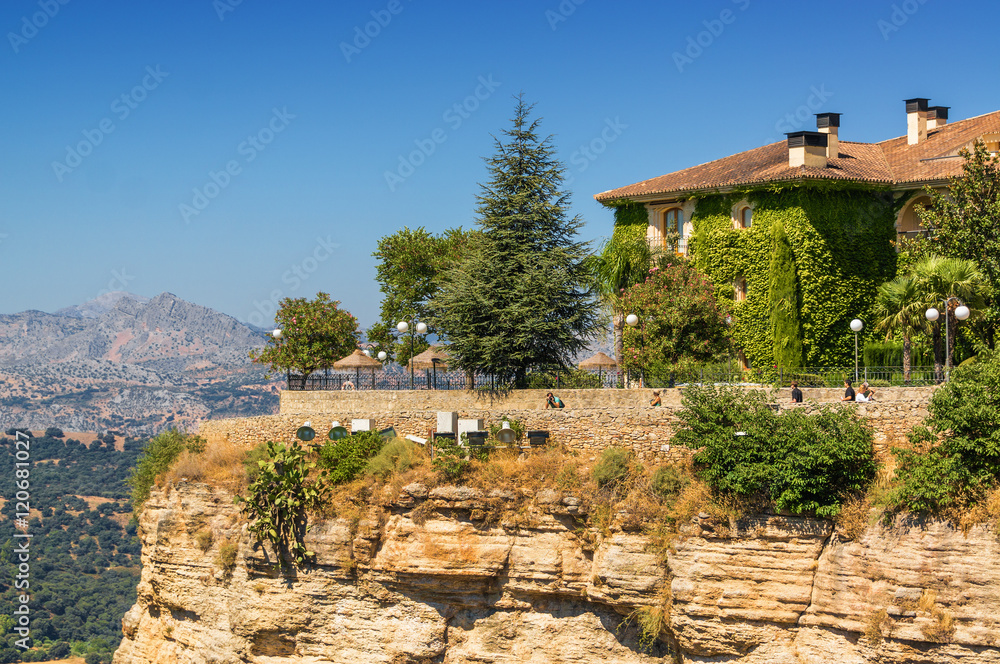 Fototapeta premium Buildings on the cliffside of El Tajo Gorge in Ronda, Malaga province, Spain.