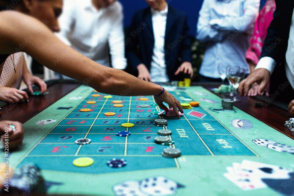 Fototapeta premium People play poker in the casino