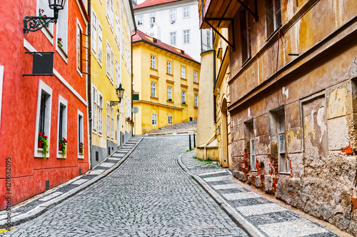 Narrow cobblestone street in old town © unclepodger