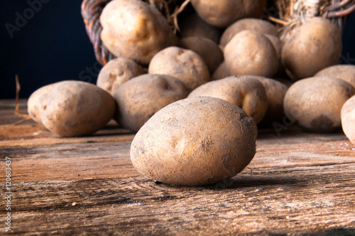 Potetoes on wooden table