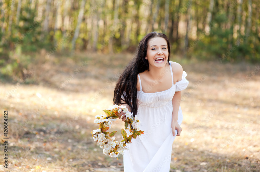 Woman in the forest with flowers Woman in the forest with flowers