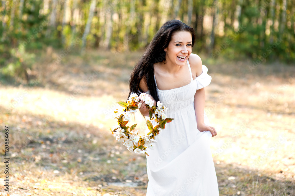 Woman in the forest with flowers Woman in the forest with flowers