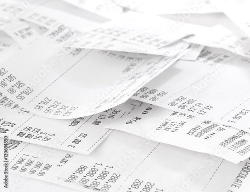 cash register receipts in a pile photo