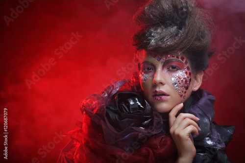 Portrait of young stylisn woman with creative visage. photo