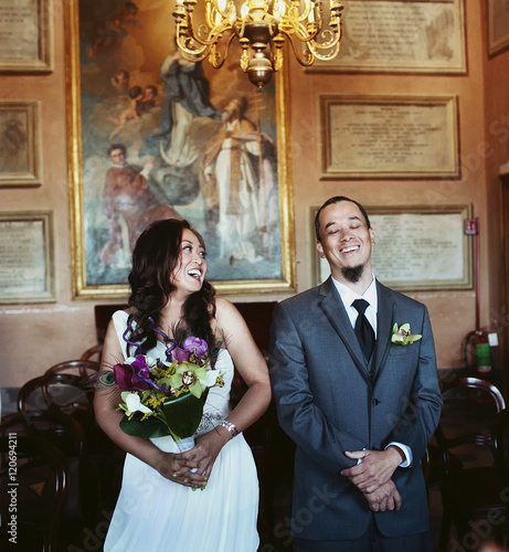 Happy newlyweds in the hall photo