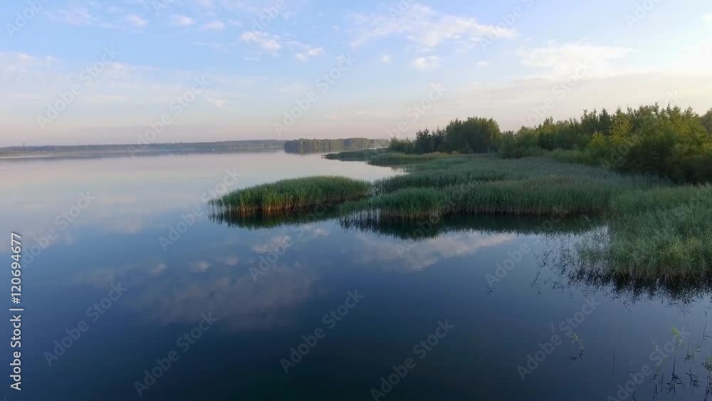 Sunrise at summer time lake and green forest, sand and reflection in water, Poland lanscape. View from above. Sunrise at summer time lake and green forest, sand and reflection in water, Poland lanscape. View from above.