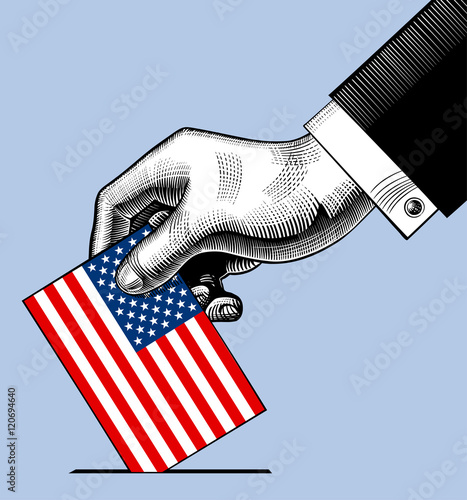 Hand putting voting paper with the USA flag