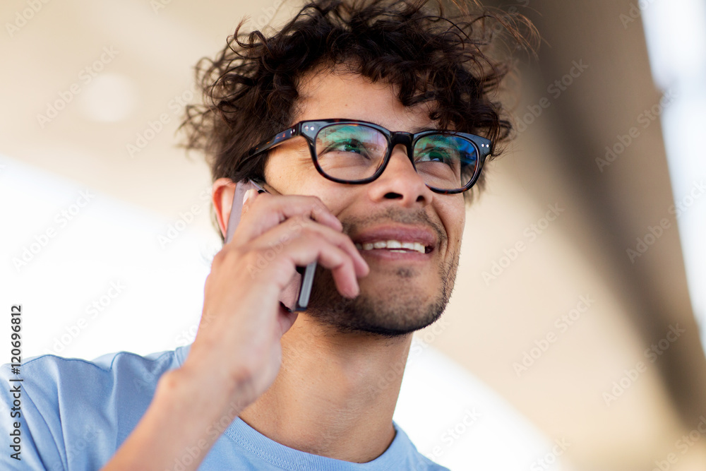 man with smartphone calling on city street