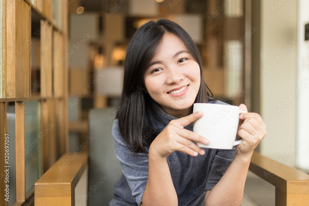 Woman drinking coffee in the morning at cafe Woman drinking coffee in the morning at cafe