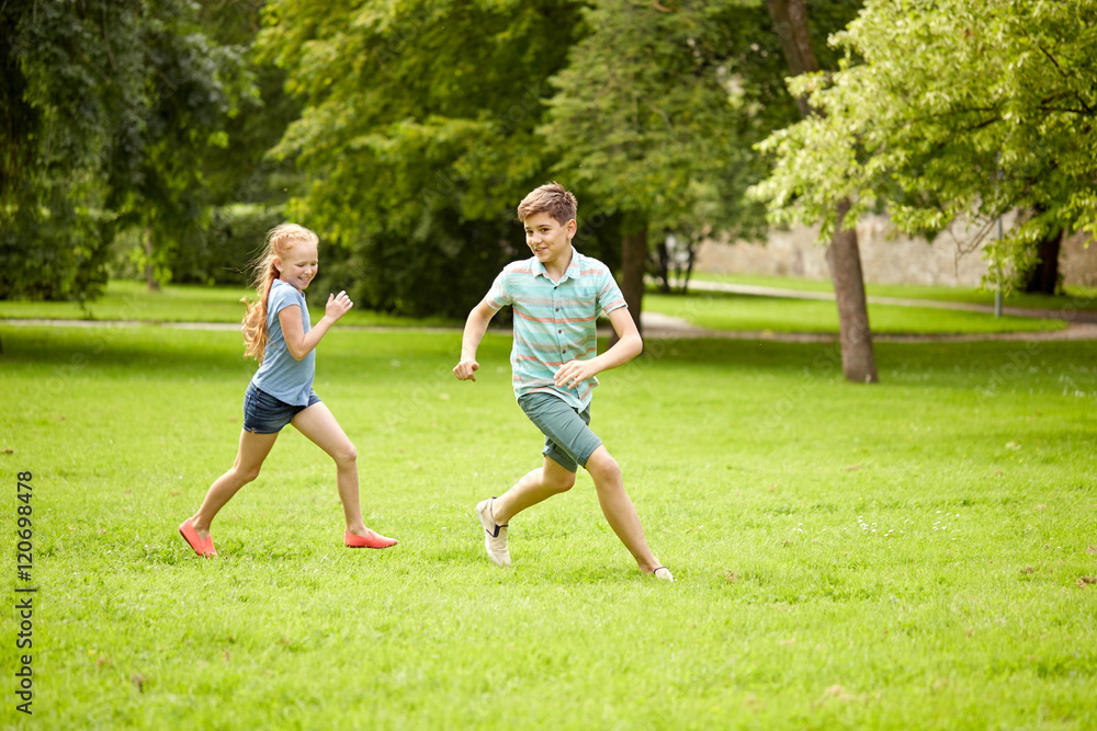 happy kids running and playing game outdoors happy kids running and playing game outdoors