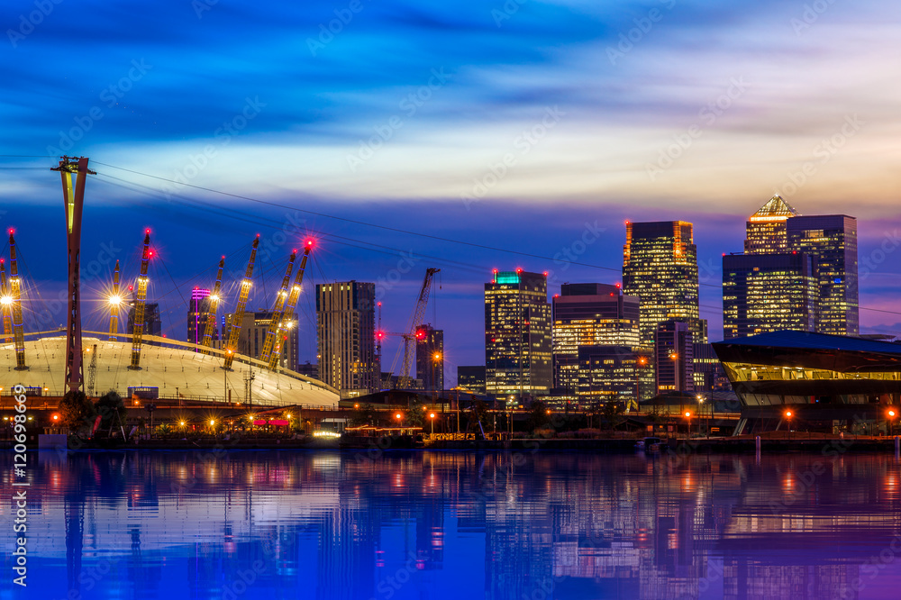 The O2 and Canary Wharf from the Royal Victoria Dock at night in London