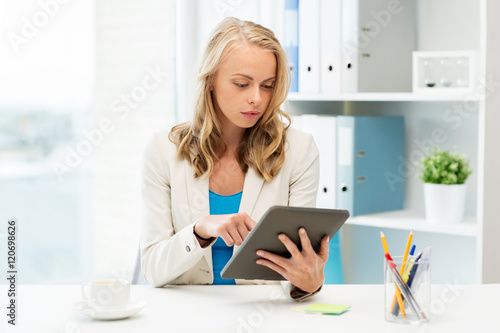 businesswoman or student with tablet pc at office