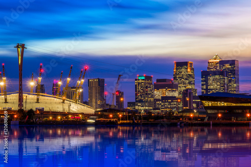 The O2 and Canary Wharf from the Royal Victoria Dock at night in London