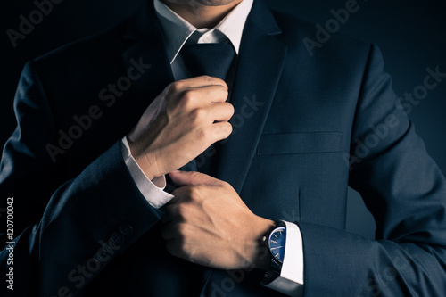 Businessman Adjust Necktie his Suit
