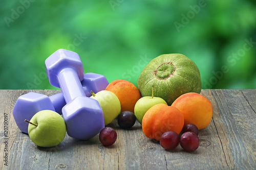 healthy lifestyle dumbbell smart watch and fruit