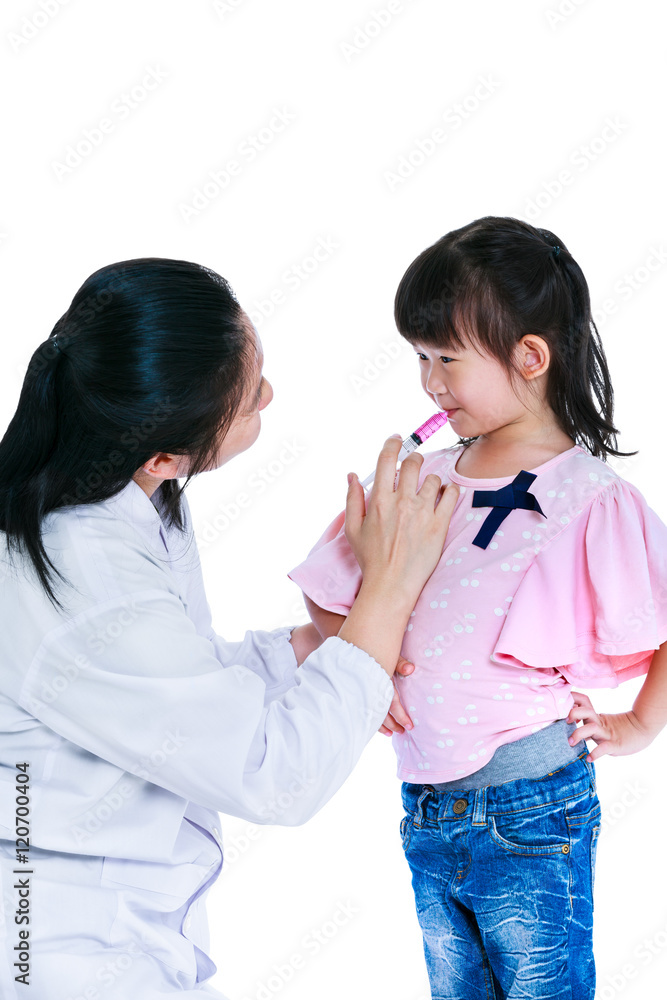 Doctor giving child medication by syringe. Isolated on white background. Doctor giving child medication by syringe. Isolated on white background.