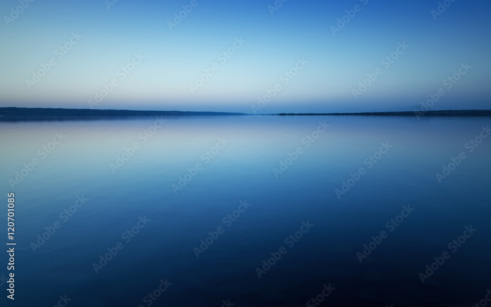 Fototapeta premium Landscape with sunset over lake