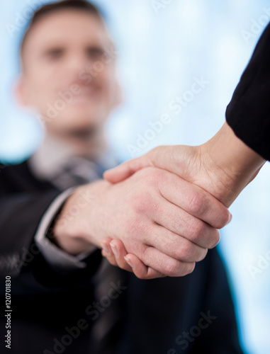 Businessman shaking hands - Focus concept.