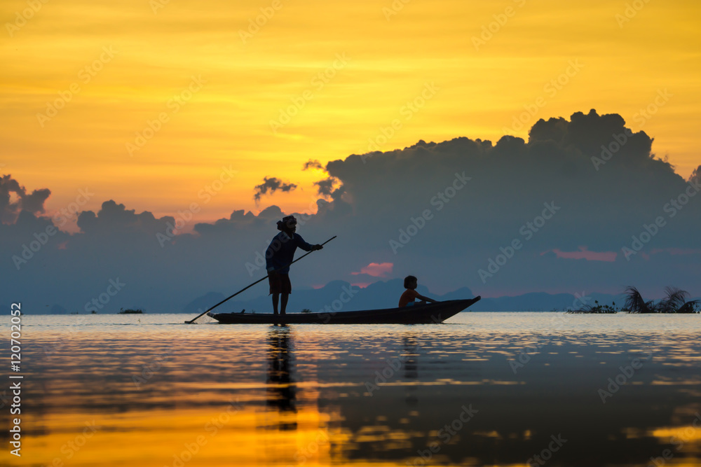 Beautiful sky and Silhouettes of fisherman at the lake, Thailand