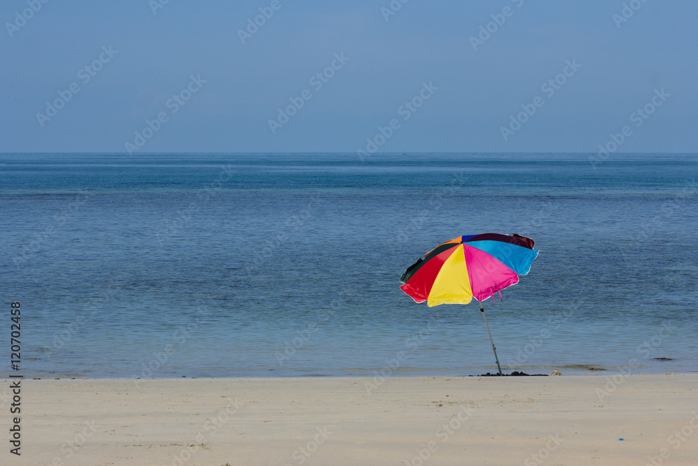 Colorfull strip umbrella in Andaman Ocean background.