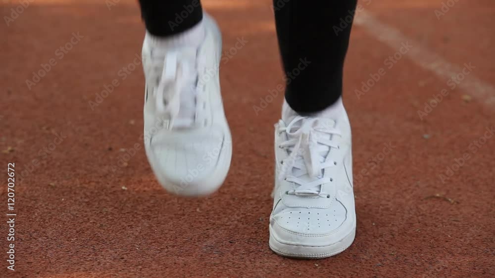 Running sport shoes on runner. Legs and running shoe closeup of man jogging Running sport shoes on runner. Legs and running shoe closeup of man jogging